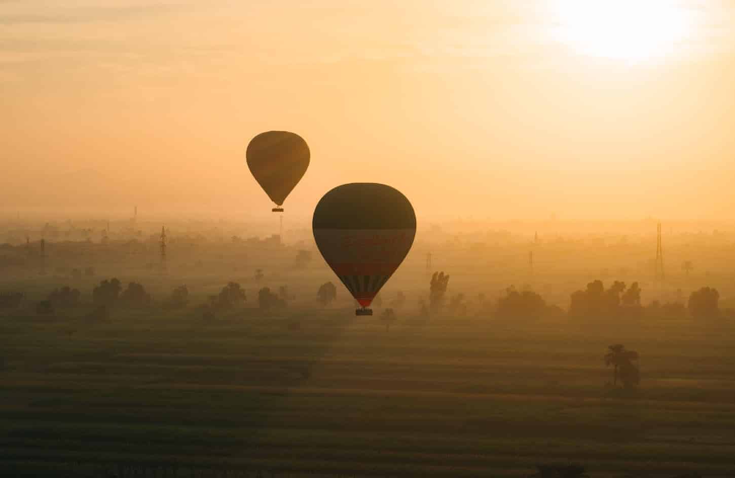 A wonderful photo of a sunset hot air balloon ride in Luxor