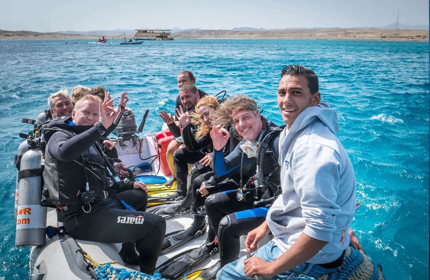A great photo of a group of tourists on a diving trip from above the buoy in Marsa Alam