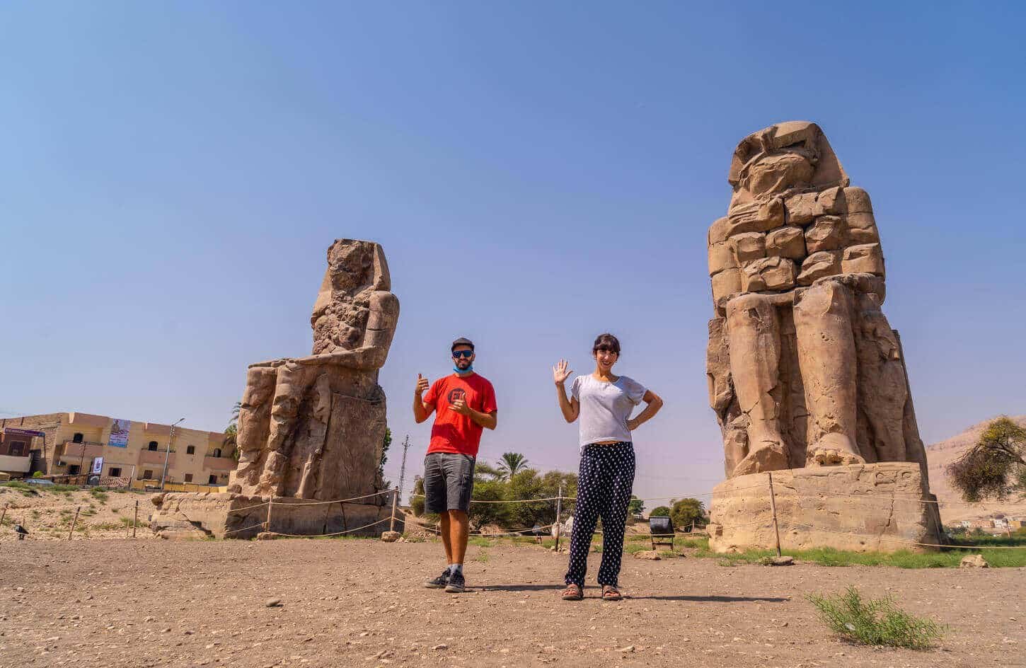 A picture of a couple from their visit to the two statues of Memnon in Luxor
