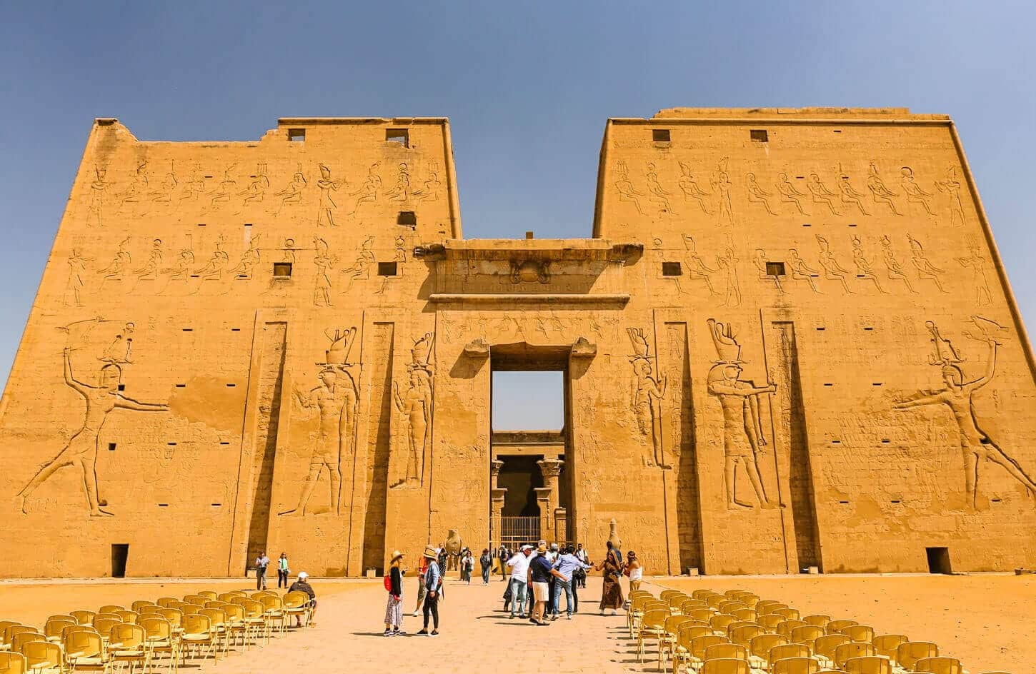 A picture of some visitors in front of the magnificent Edfu Temple