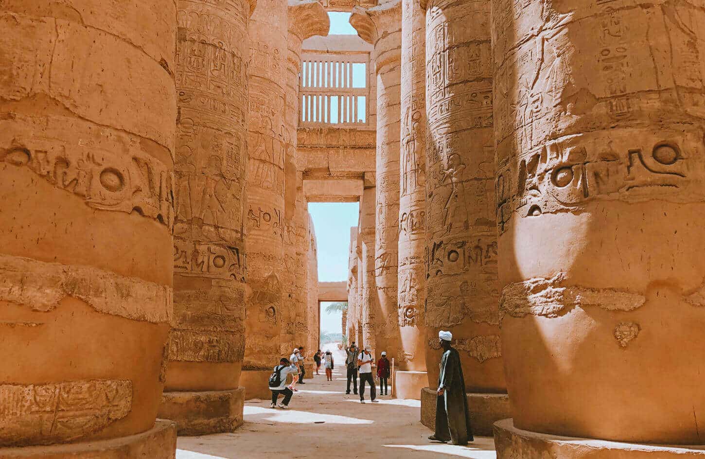 A picture of some visitors near the columns of Karnak Temple
