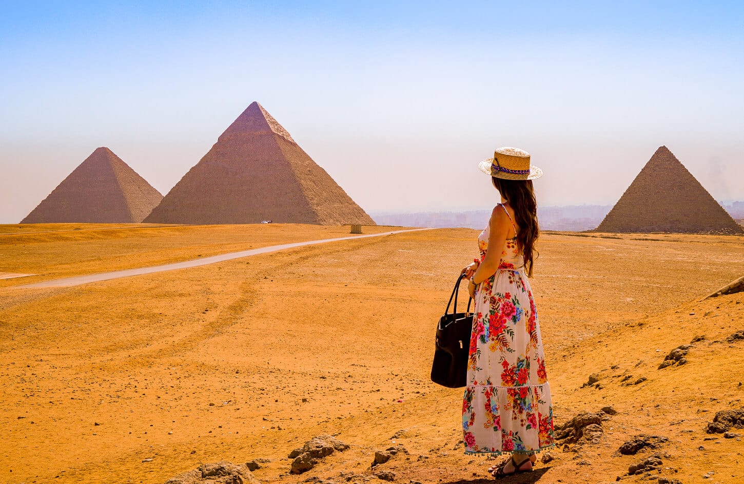 A woman visits the pyramids