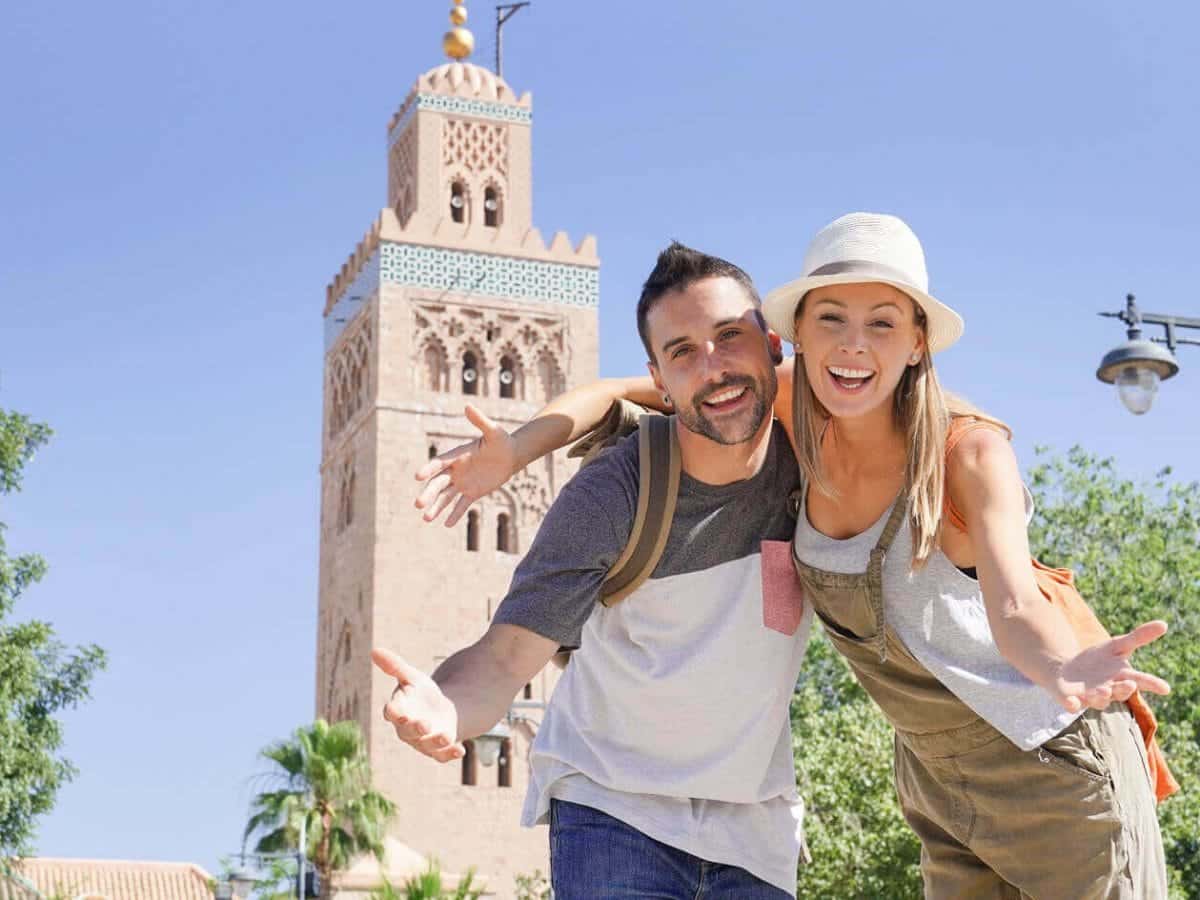 A wonderful picture of a couple in front of the Sultan Hassan Mosque in Morocco