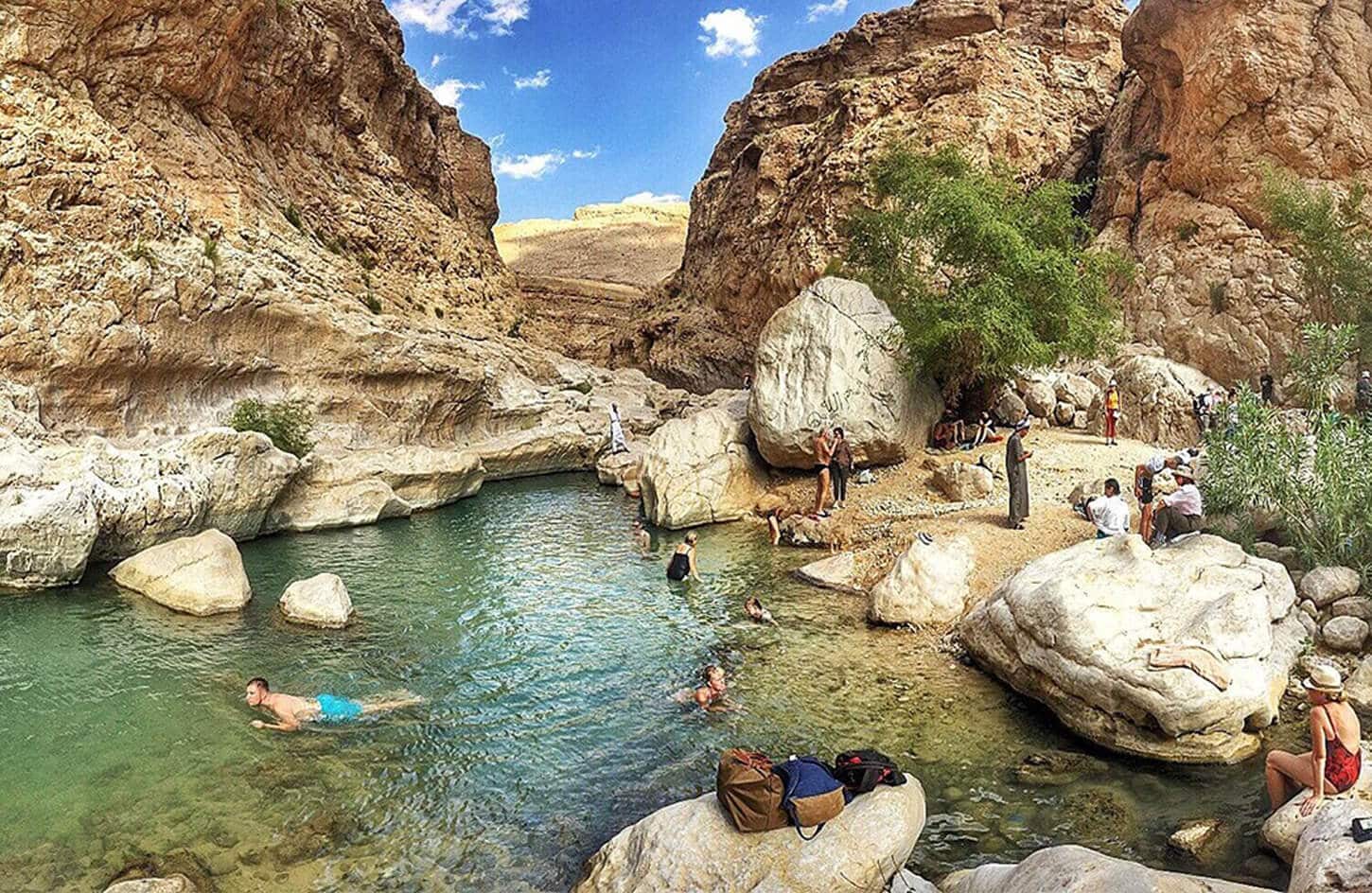 A wonderful picture of a group of tourists in Wadi Bani Khalid