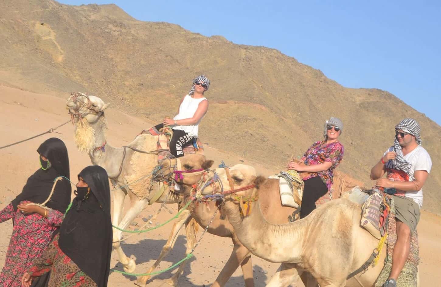 A wonderful picture of a group of tourists in the Marsa Alam desert on camels