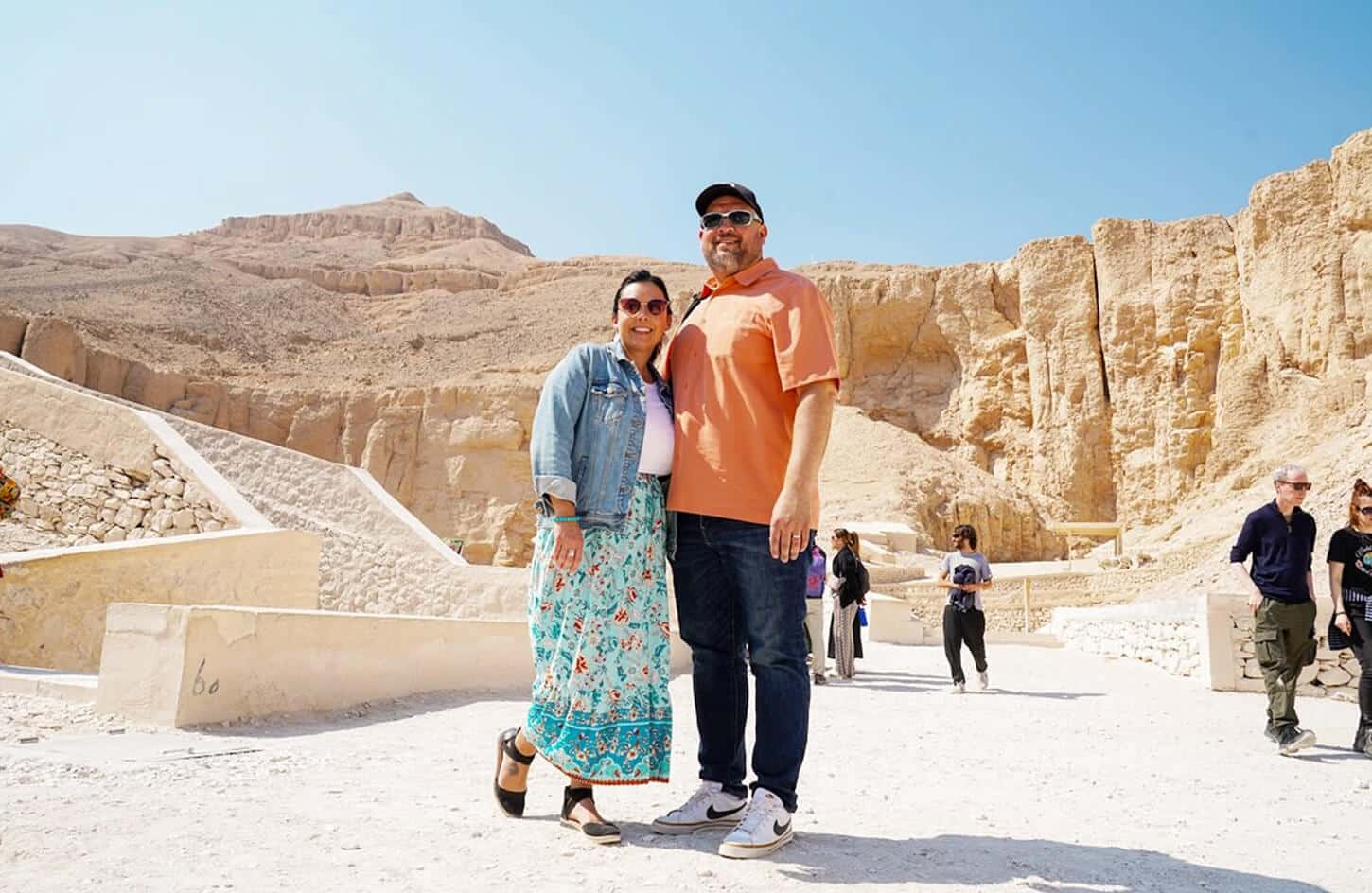 A wonderful picture of the couple in front of the Valley of the Kings outside
