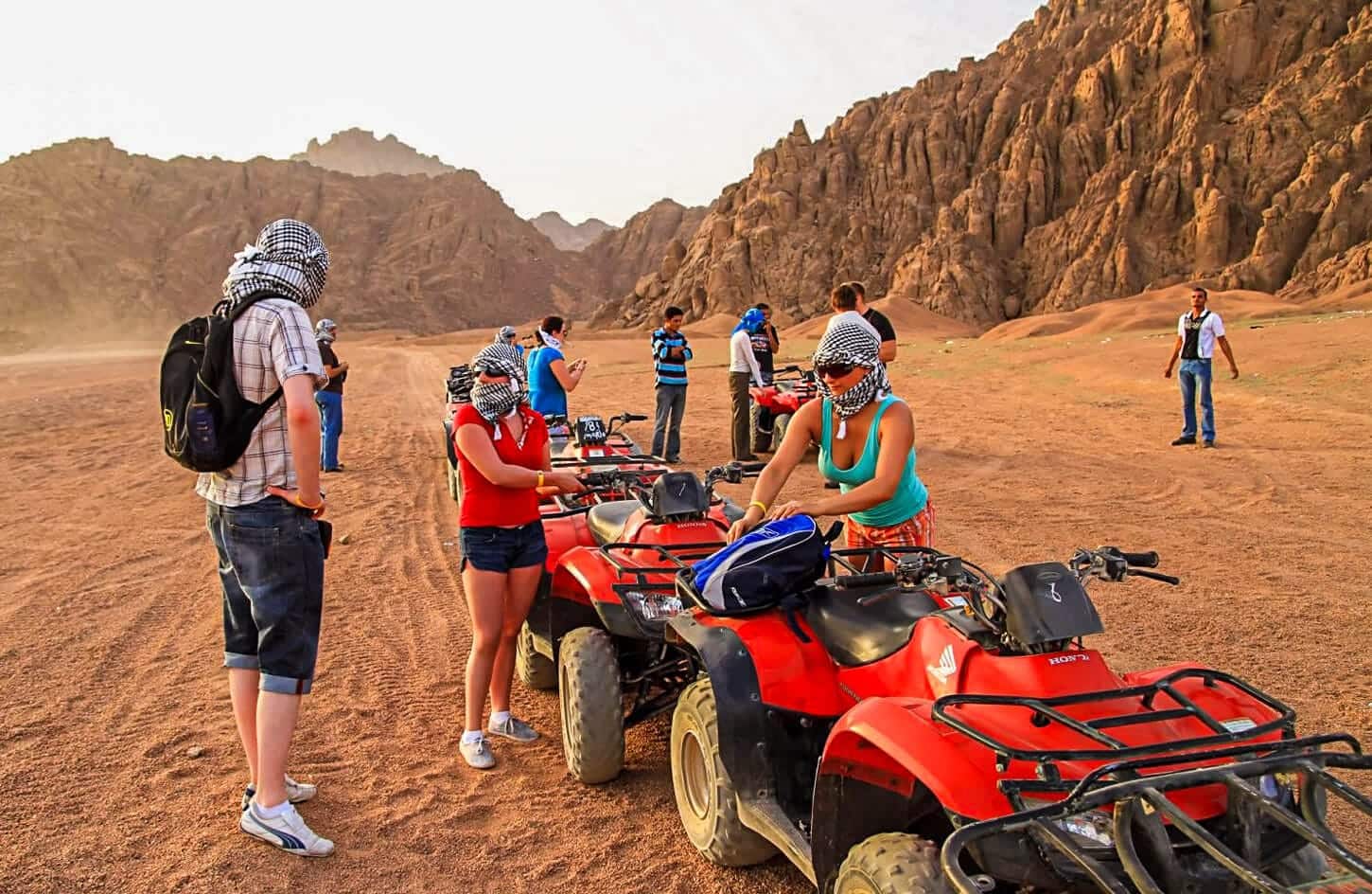 A wonderful shot of a group of people preparing to ride a quad bike from one of the safari trips in Hurghada