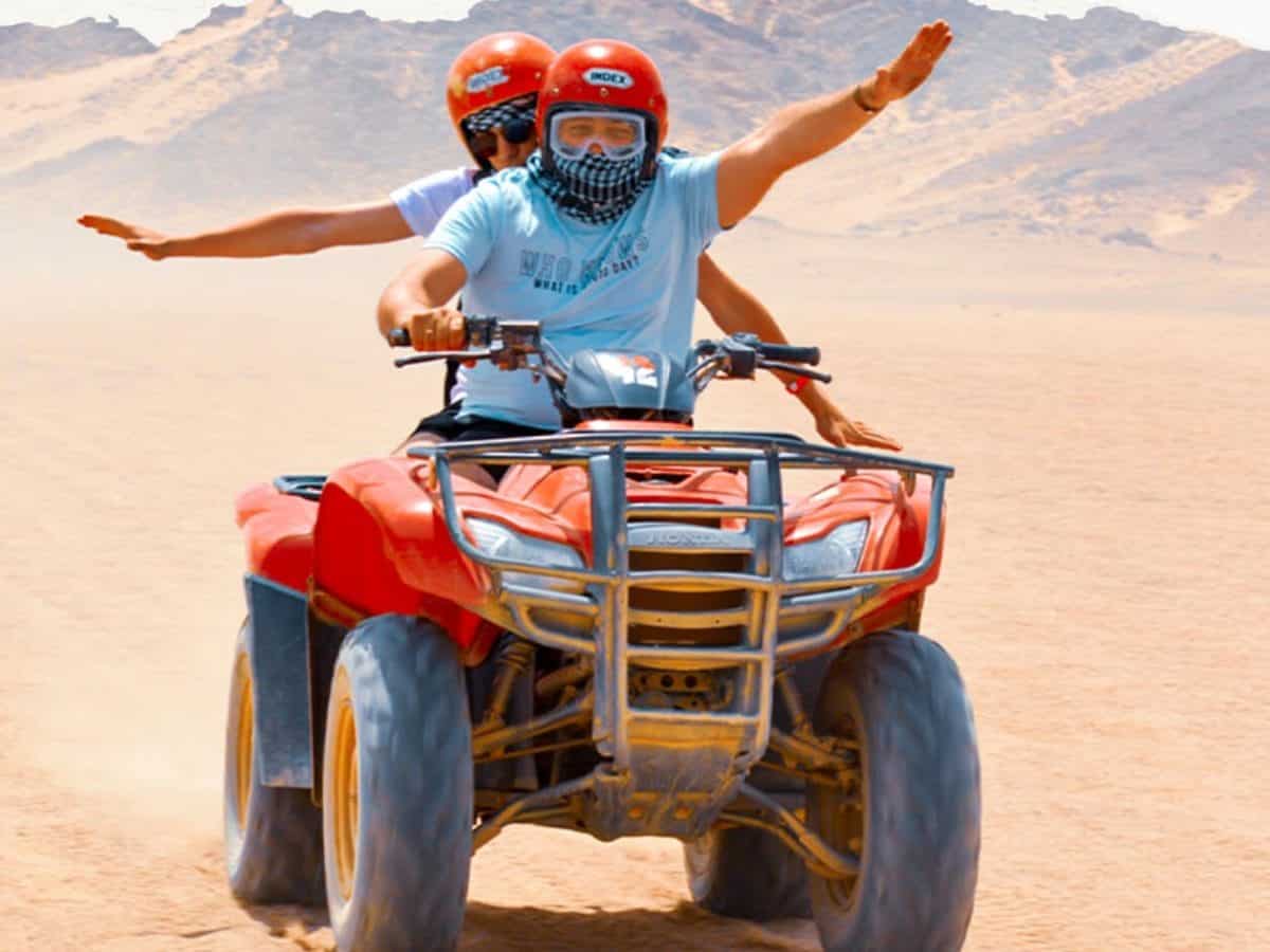 A wonderful shot of two people riding a quad bike from one of the safari trips in Hurghada