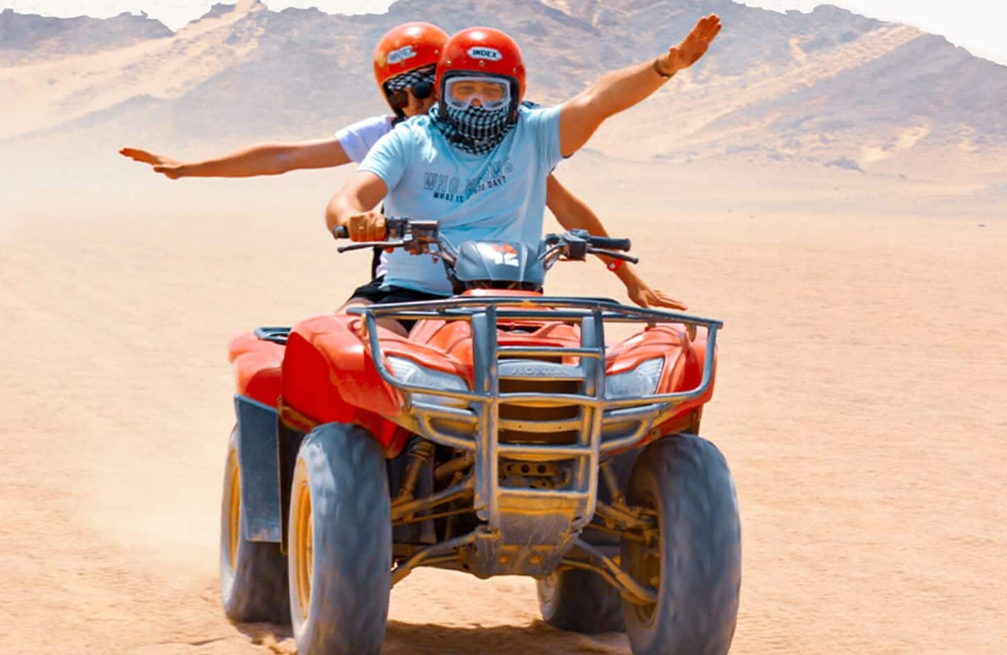 A wonderful shot of two people riding a quad bike from one of the safari trips in Hurghada