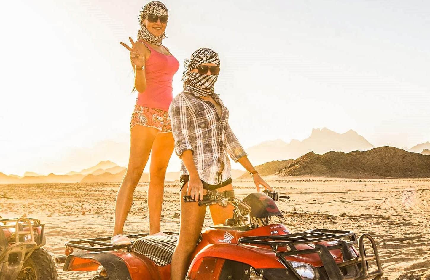 A wonderful shot of two people riding a quad bike from one of the safari trips