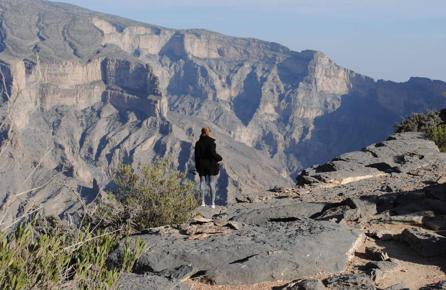 Beautiful pictures of a woman from the top of the mountains of Oman