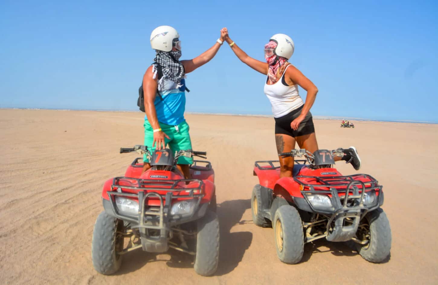 Great photo of a couple of tourists in Marsa Alam desert Quad bike