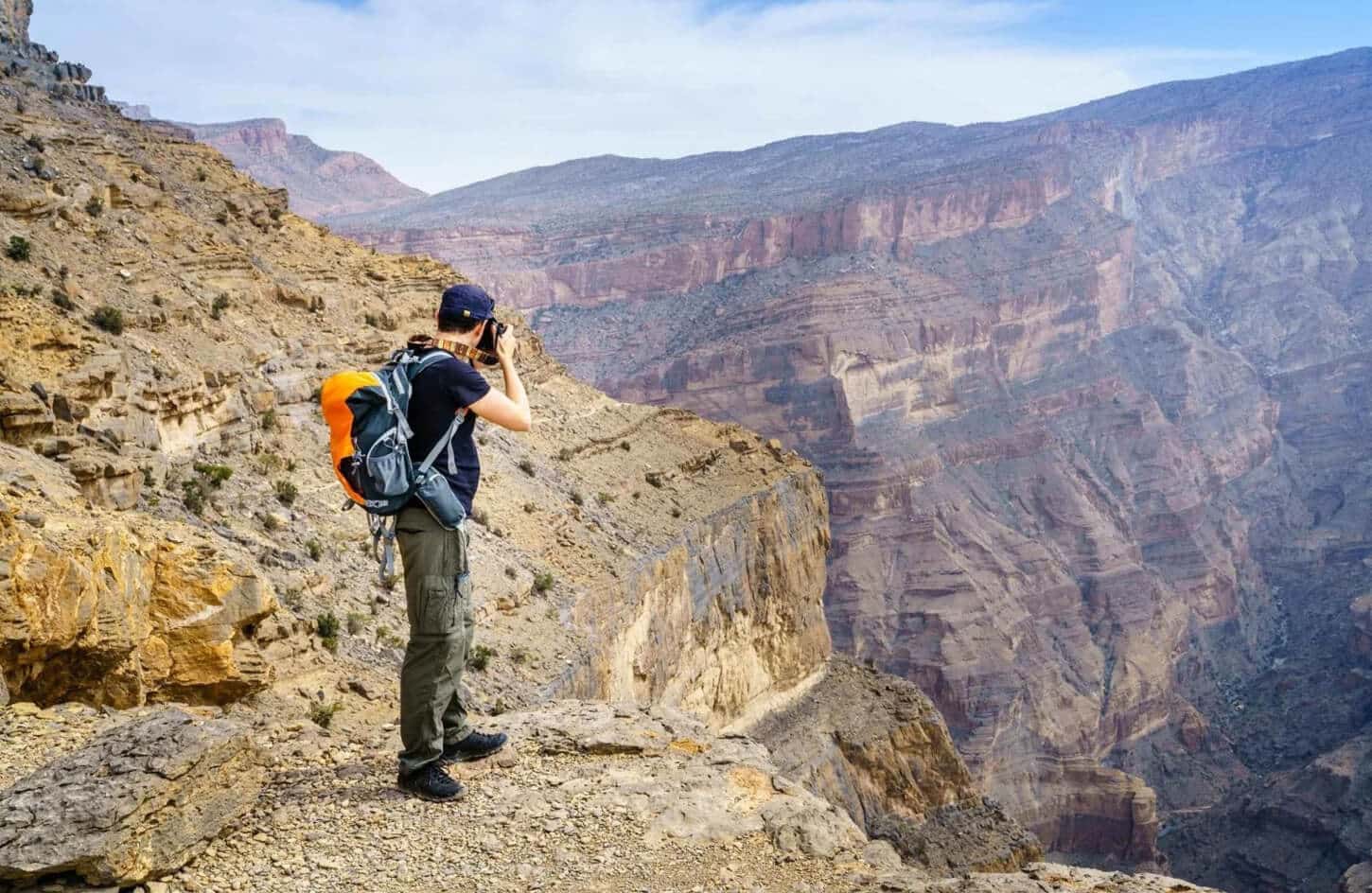 Great picture of tourists taking pictures of the most beautiful mountains in Oman