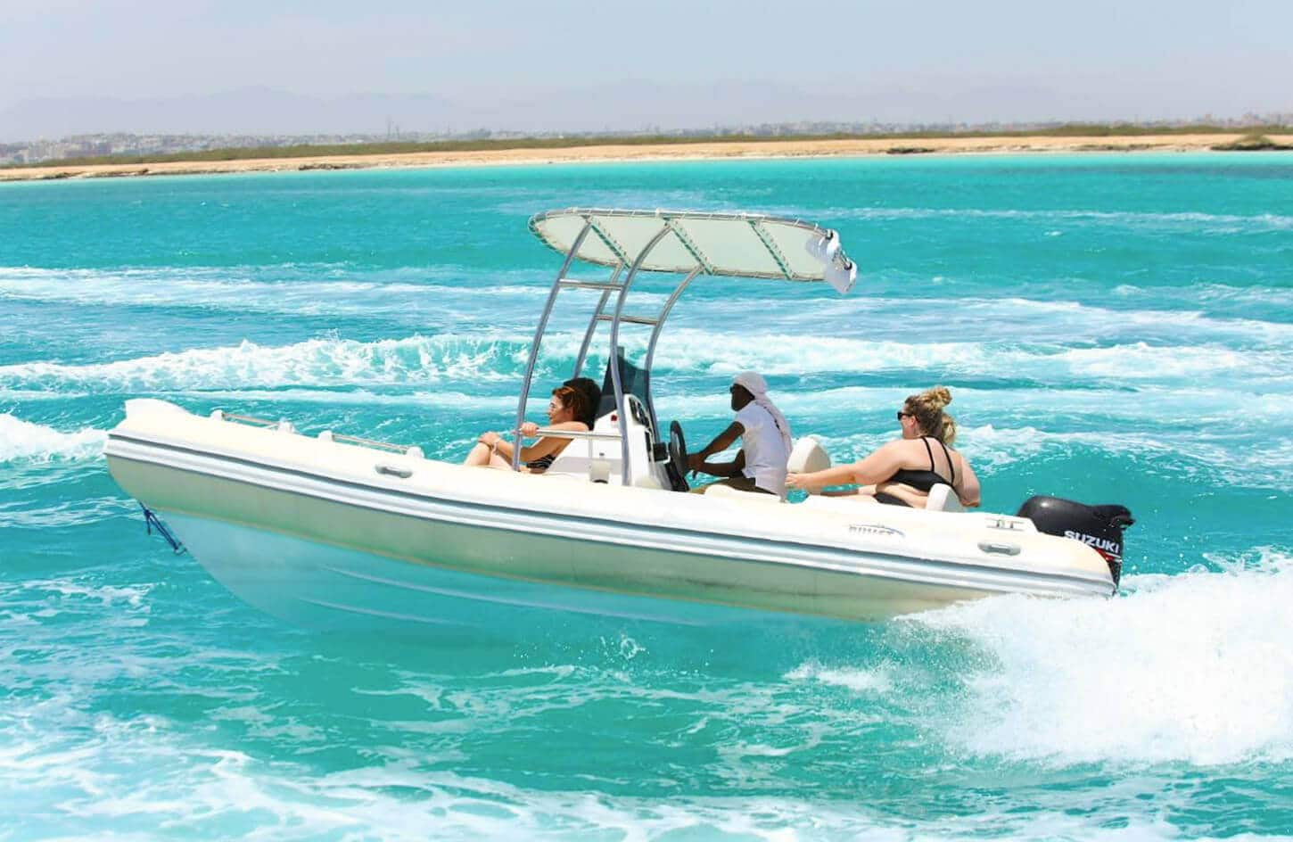 Toles photo of some tourists on a speedboat tour in Hurghada