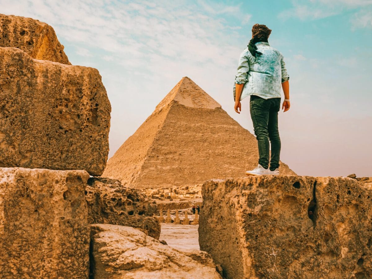 Tourist man standing in front of the pyramid of Khafre