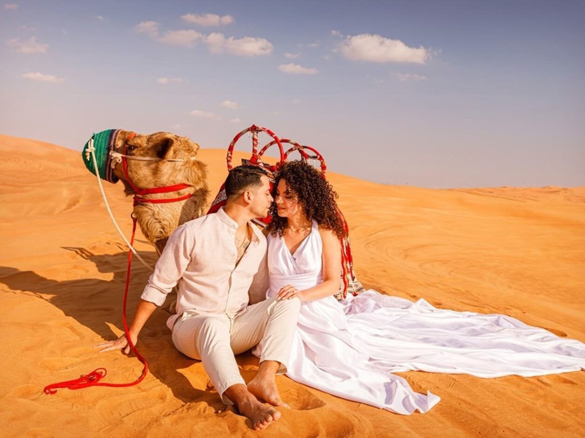 Wonderful photo of couple with camels in Dubai desert