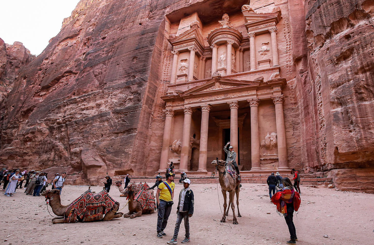 A wonderful photo of a tourist in front of the Petra Temple - Is the Middle East Safe for Tourists in 2026?