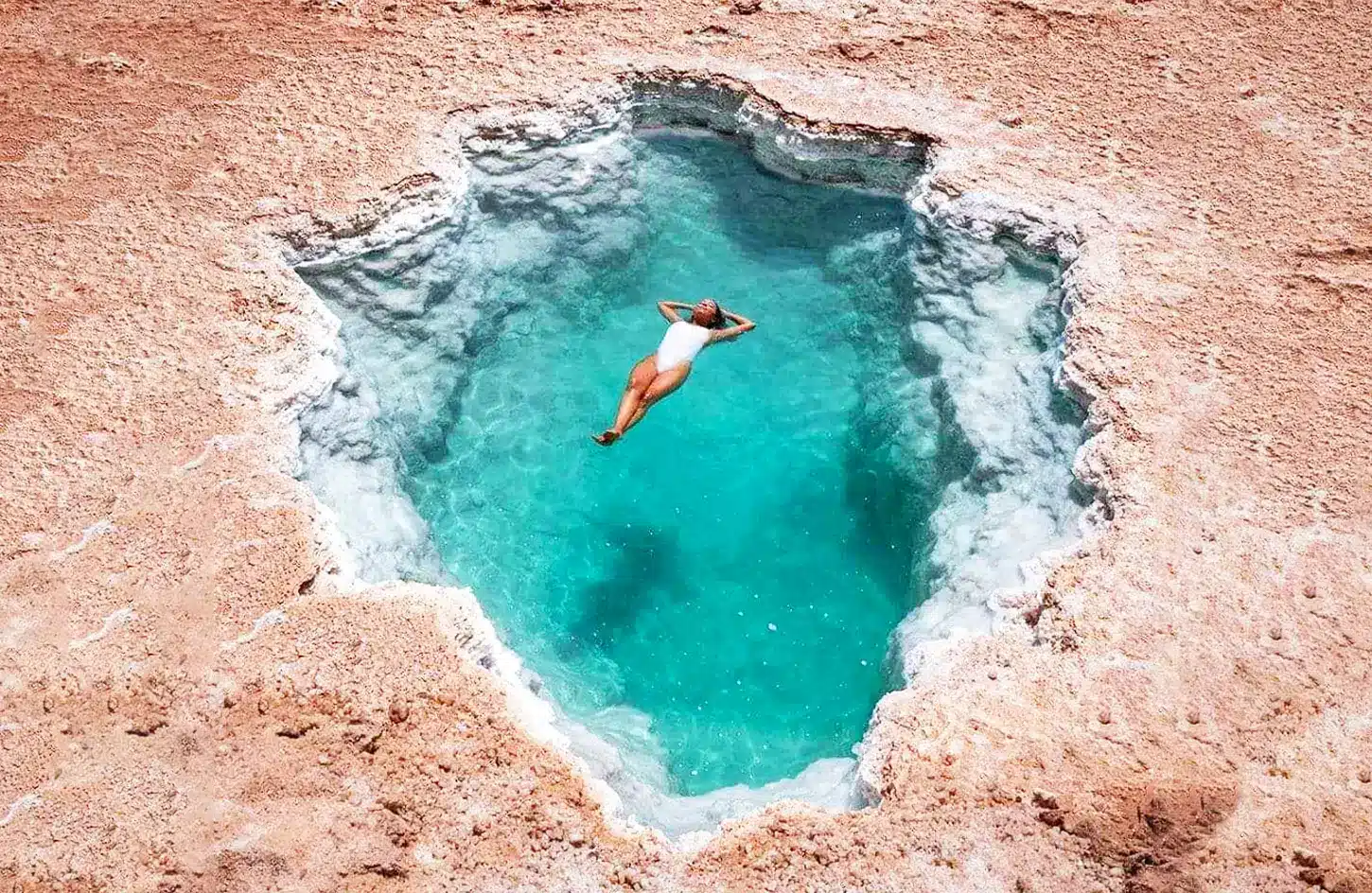 Best Places to Visit in Egypt: The Complete Travel Guide 5 Traveler floating in the mineral-rich salt lake at Siwa Oasis, Western Desert, Egypt - Best Places to Visit in Egypt