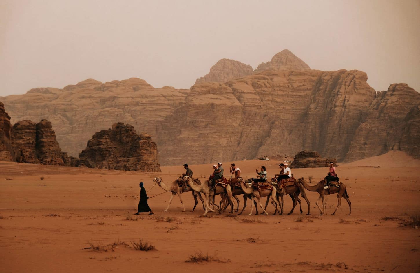 a special shot of a group of tourists in wadi rum