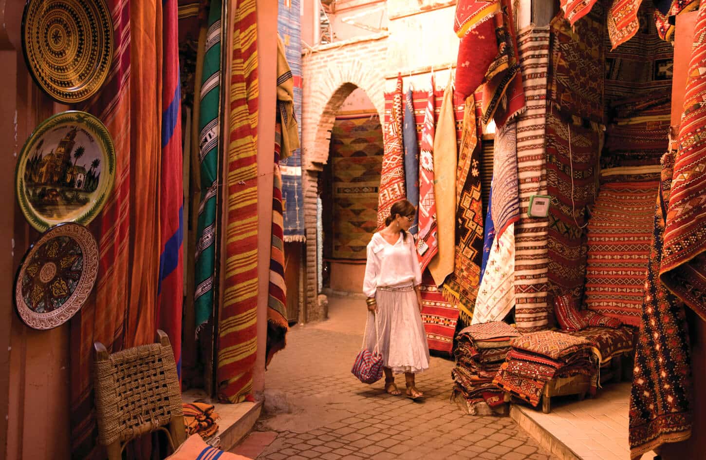 A wonderful photo of a tourist in a fabric market in Morocco