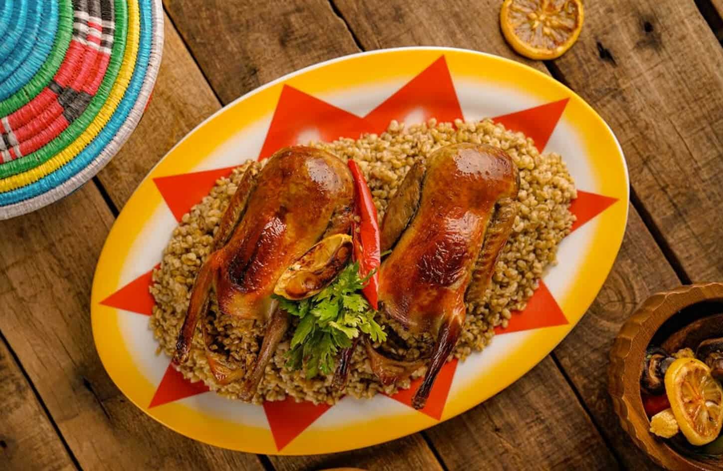 Egyptian stuffed pigeon hamam mahshi filled with rice and spices on a serving plate