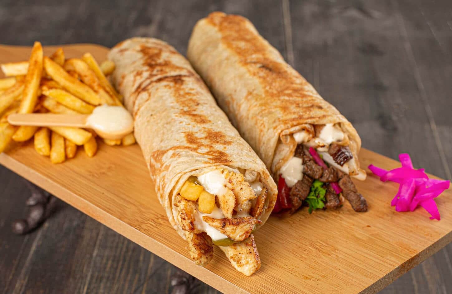Egyptian chicken shawarma wrap with tahini sauce, pickled vegetables, and bread, Cairo street food
