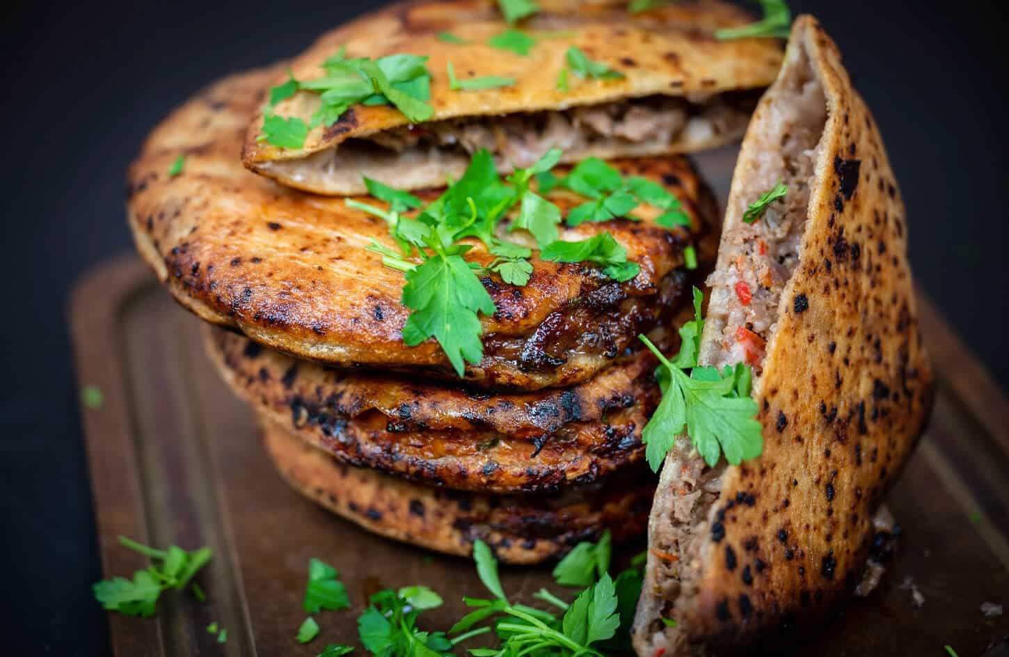 Egyptian hawawshi crispy baked flatbread stuffed with spiced minced beef and onions