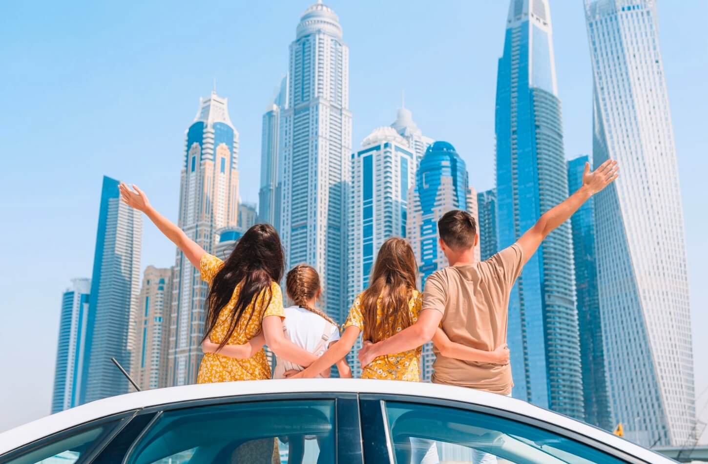 a family is enjoying the stunning view of the dubai skyline