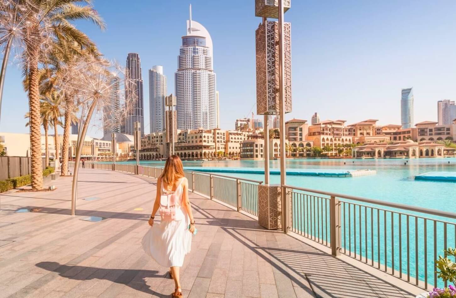 traveler exploring the modern skyline near burj khalifa enjoying the pleasant weather of the best time to visit dubai