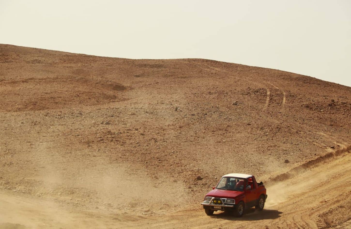 wonderful shot of some tourists riding in a fourwheel drive vehicle in marsa alam