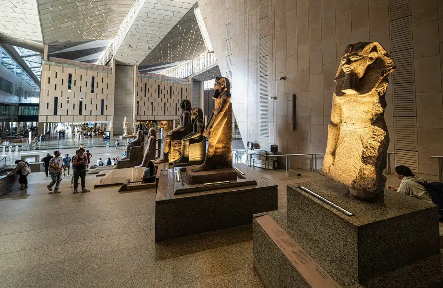 Grand Egyptian Museum interior featuring Ancient Egyptian pharaoh statues on the grand staircase in Giza. - 3 Day Cairo Itinerary: The Local Expert's Guide to Getting It Right