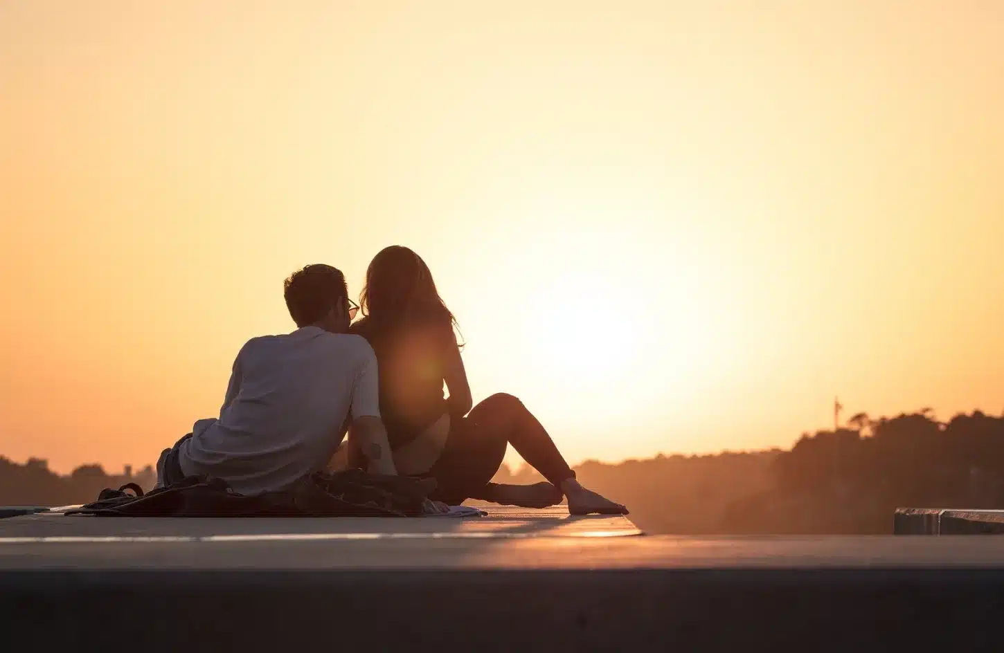 A beautiful photo of a couple at sunset in Siwa Oasis. - Romantic Spots to Visit in Egypt