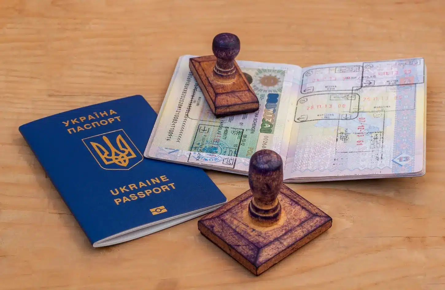 Egypt Visa Guide 2026: e-Visa, Visa on Arrival & Everything You Need to Know 1 Passport standing open on a map with visa pages visible, representing international travel and entry visa requirements. - Egypt Visa Guide