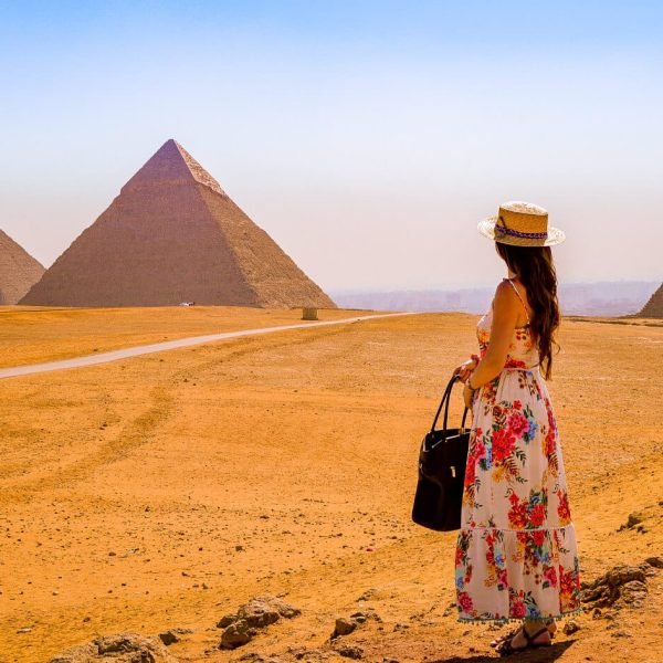 A woman visits the pyramids