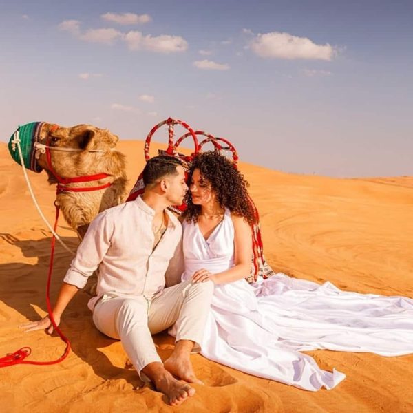 Wonderful photo of couple with camels in Dubai desert